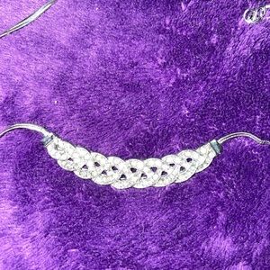 New, never worn. Woven rhinestone necklace with tags